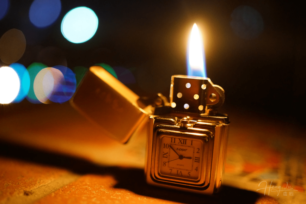 A-lit-Zippo-lighter-with-a-clock-face