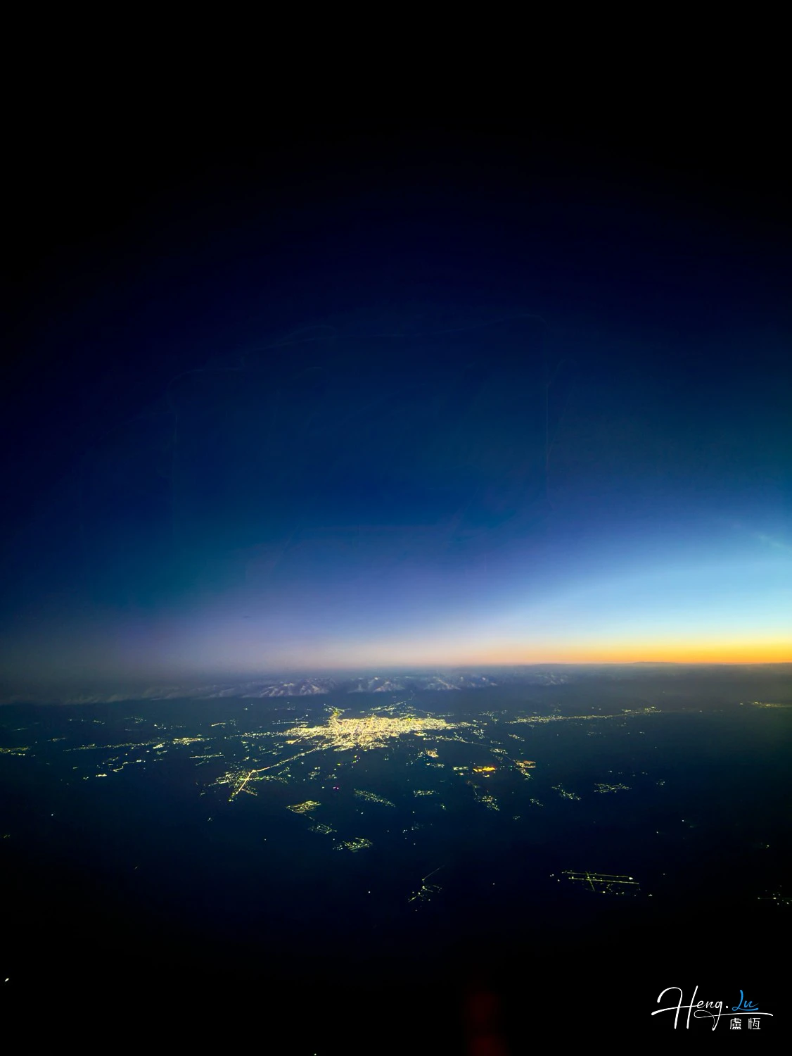 City-lights-glowing-under-deep-twilight-sky