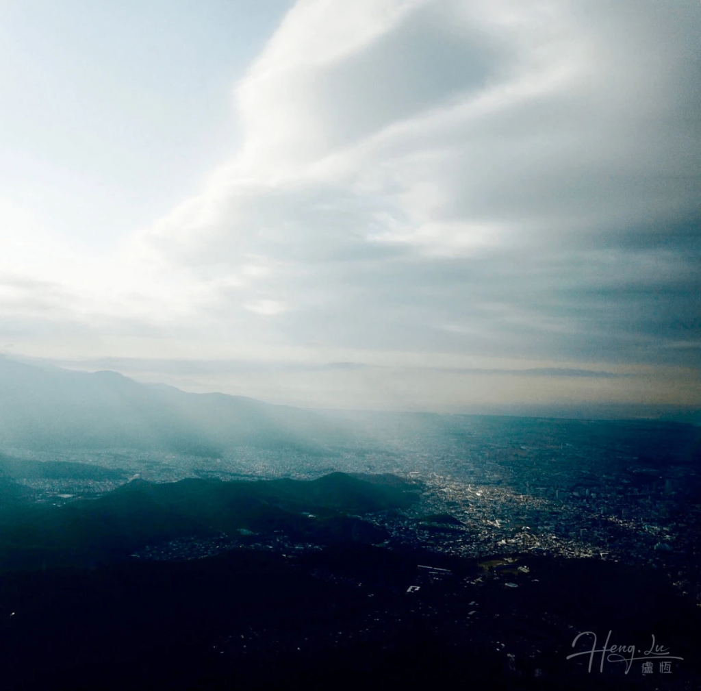 Cityscape-view-from-mountain-with-dramatic-clouds