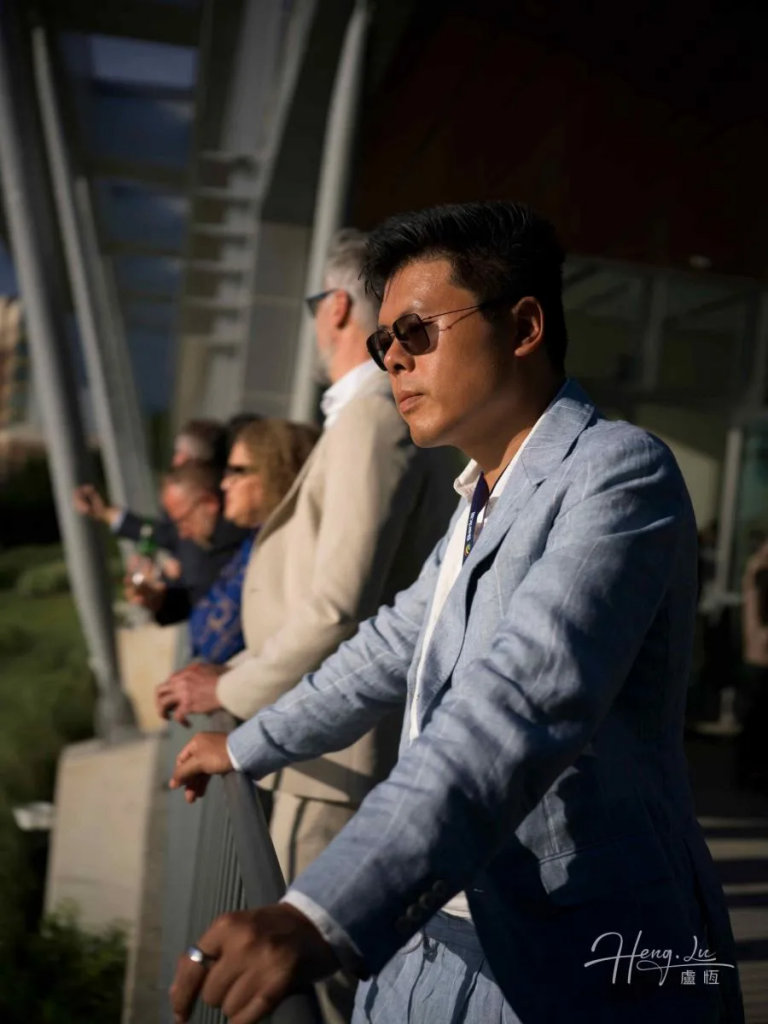 Luheng-in-light-blue-blazer-standing-on-bridge