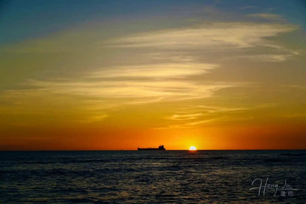 a-hawaiian-sunset-with-a-ship-on-the-horizon