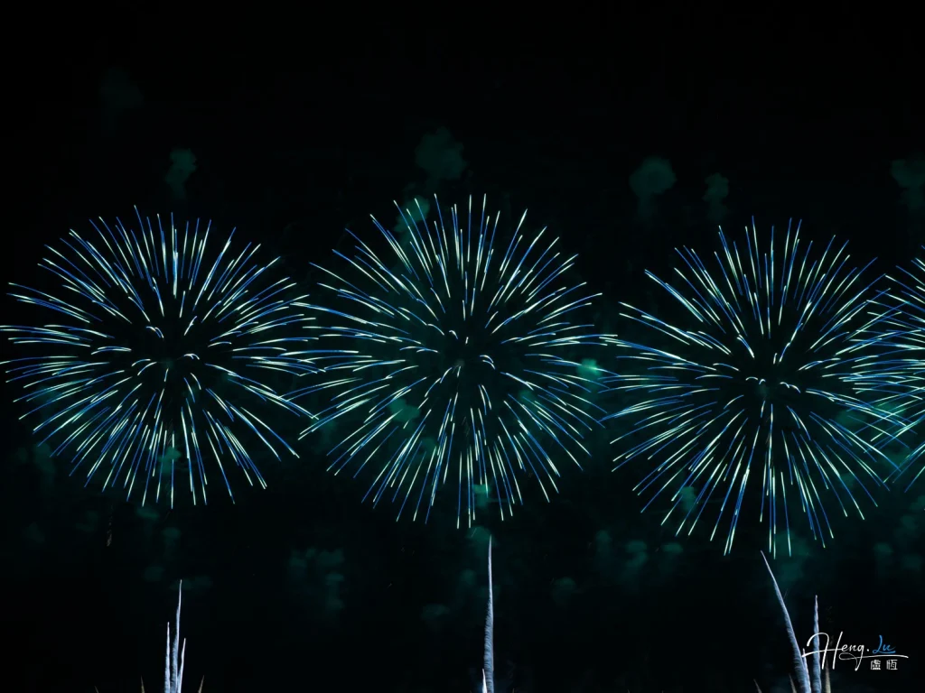 Triple-blue-fireworks-burst-in-night-sky