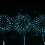 Triple-blue-fireworks-burst-in-night-sky