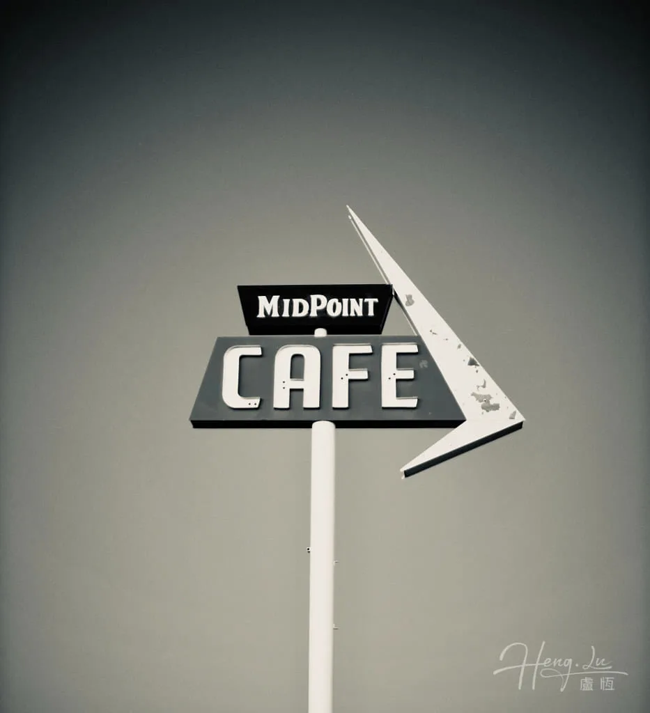 A-vintage-Midpoint-Cafe-sign-against-a-sky