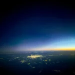 City-lights-glowing-under-deep-twilight-sky