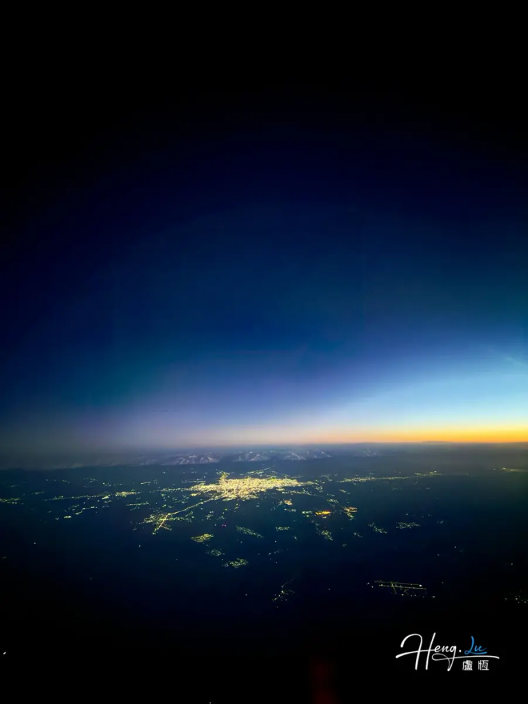 City-lights-glowing-under-deep-twilight-sky