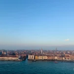 Coastal-cityscape-with-historic-buildings-under-clear-sky