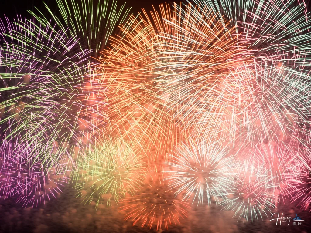 Colorful-fireworks-burst-vividly-illuminating-the-night-sky