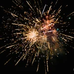 Dazzling-golden-fireworks-ignite-night-sky-with-sparkling-energ