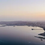 Golden-horizon-over-serene-coastal-city
