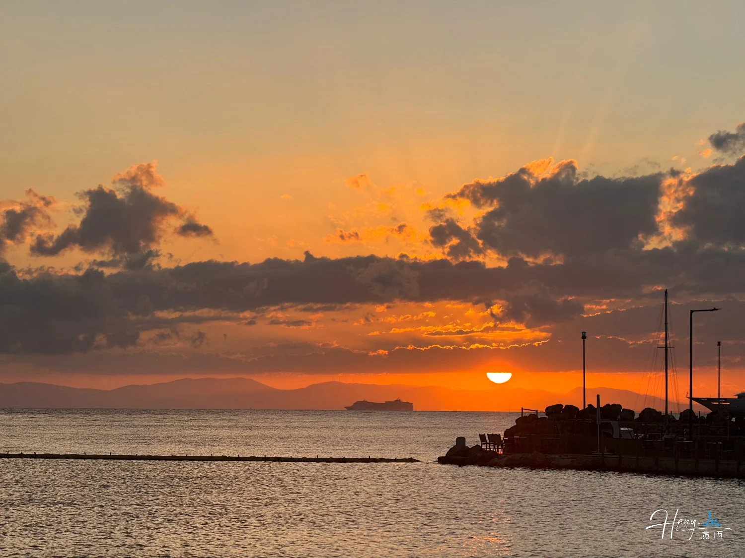 Golden-sunset-over-sea-with-distant-ship