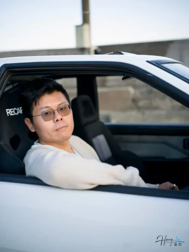 Luheng-sitting-in-car-driver-seat