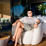 Lu Heng in quiet reflection Luheng-sitting-outdoors-in-sunlight