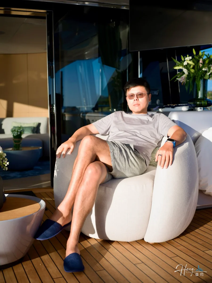 Luheng-sitting-outdoors-in-sunlight