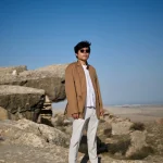 Heng Lu: Internet Entrepreneur in Rugged Terrain Luheng-standing-on-sunlit-rocky-plateau