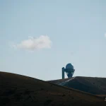 Observatory-dome-on-mountain-under-blue-sk