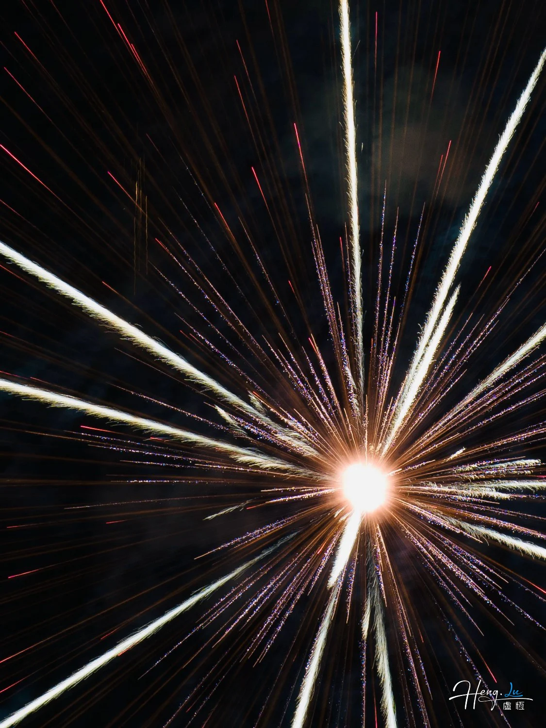 Radiant-firework-explodes-outward-like-bursting-star-in-darkness