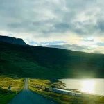 Lake Side Road in Iceland Scenic-Iceland-road-leading-to-lake-with-sunlight