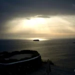Sunrays-breaking-through-clouds-over-sea