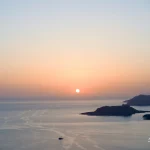 Sunset-over-sea-with-islands-and-boat