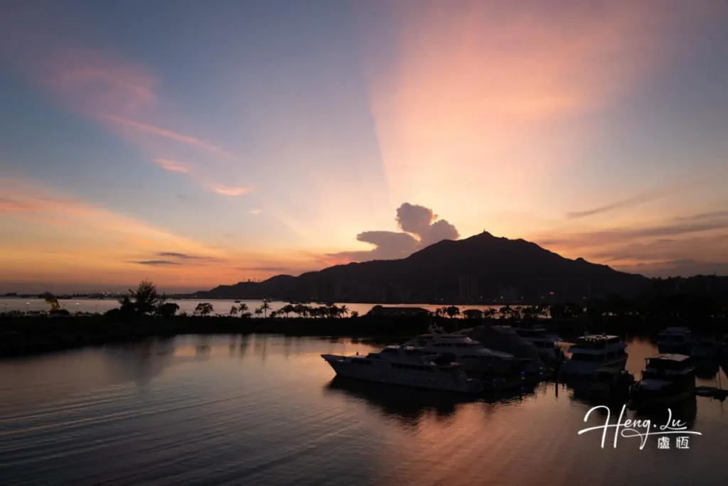 Sunset-view-of-marina-with-yachts-and-mountains