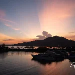Sunset-view-of-marina-with-yachts-and-mountains