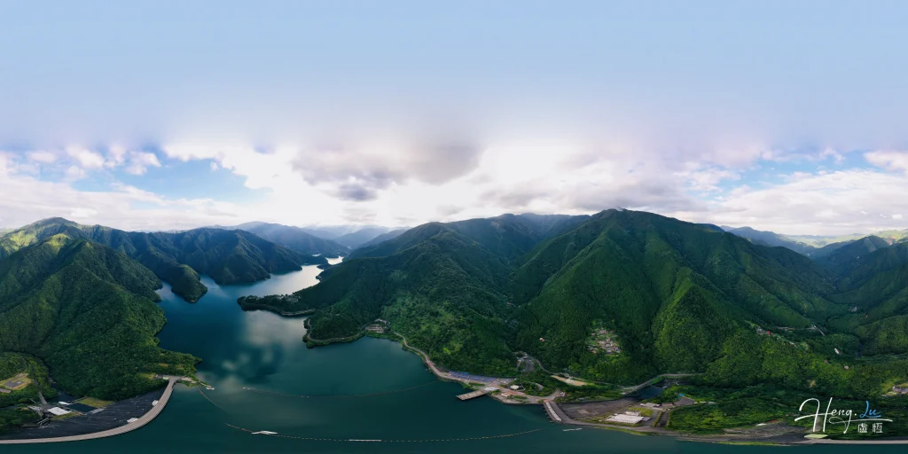 aerial-view-of-winding-lake-among-green-mountain-ranges