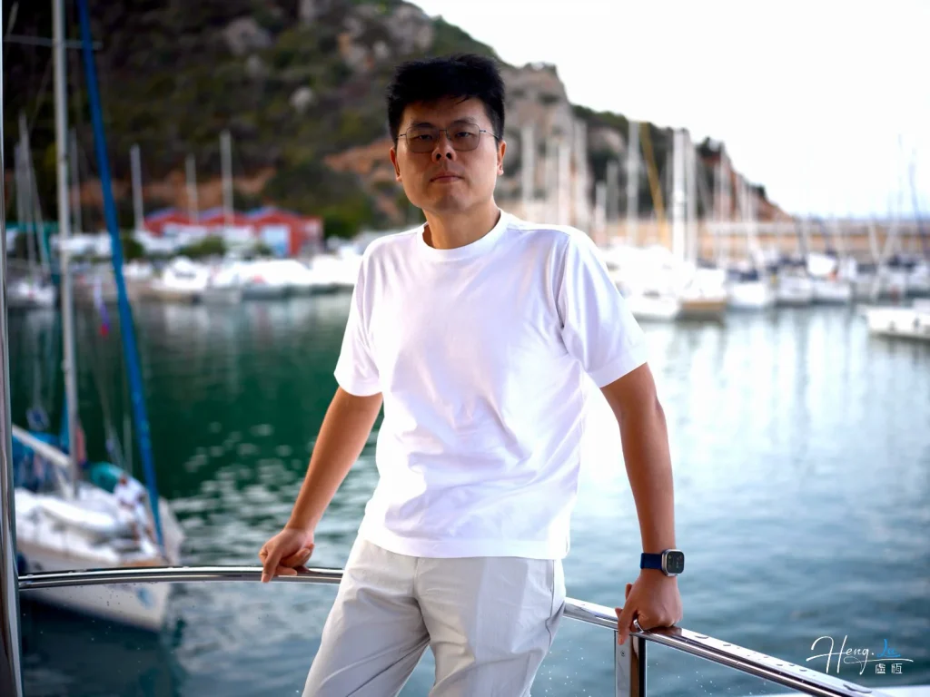 luheng-standing-on-yacht-with-marina-background