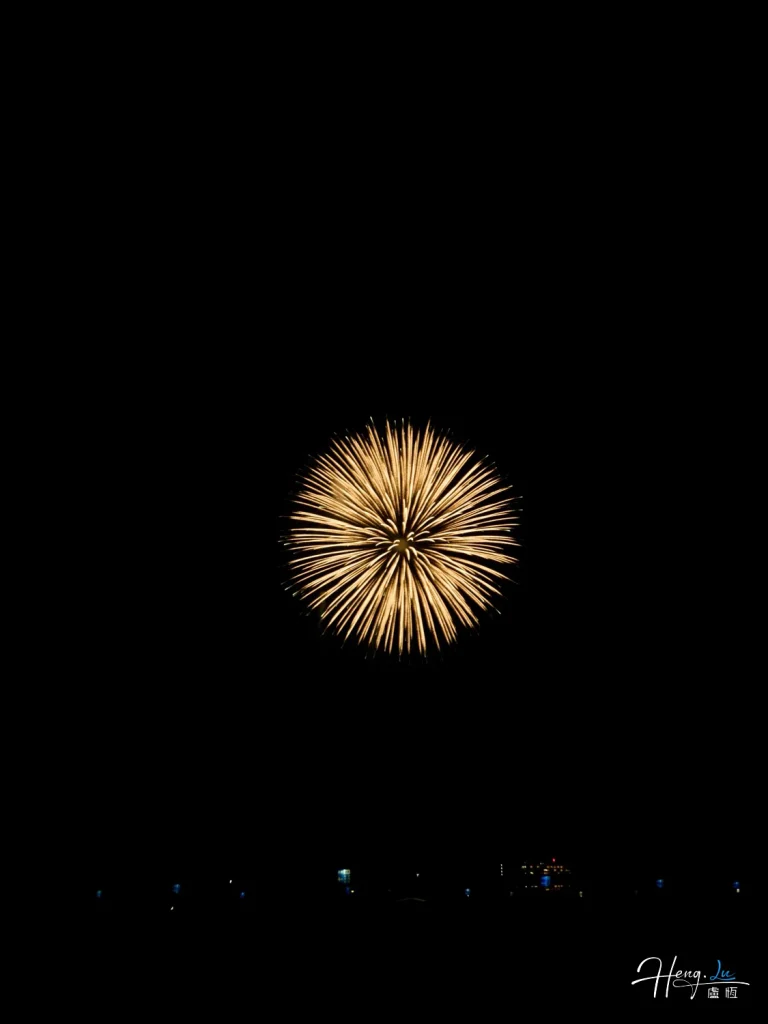 single-golden-firework-burst-against-night-sky