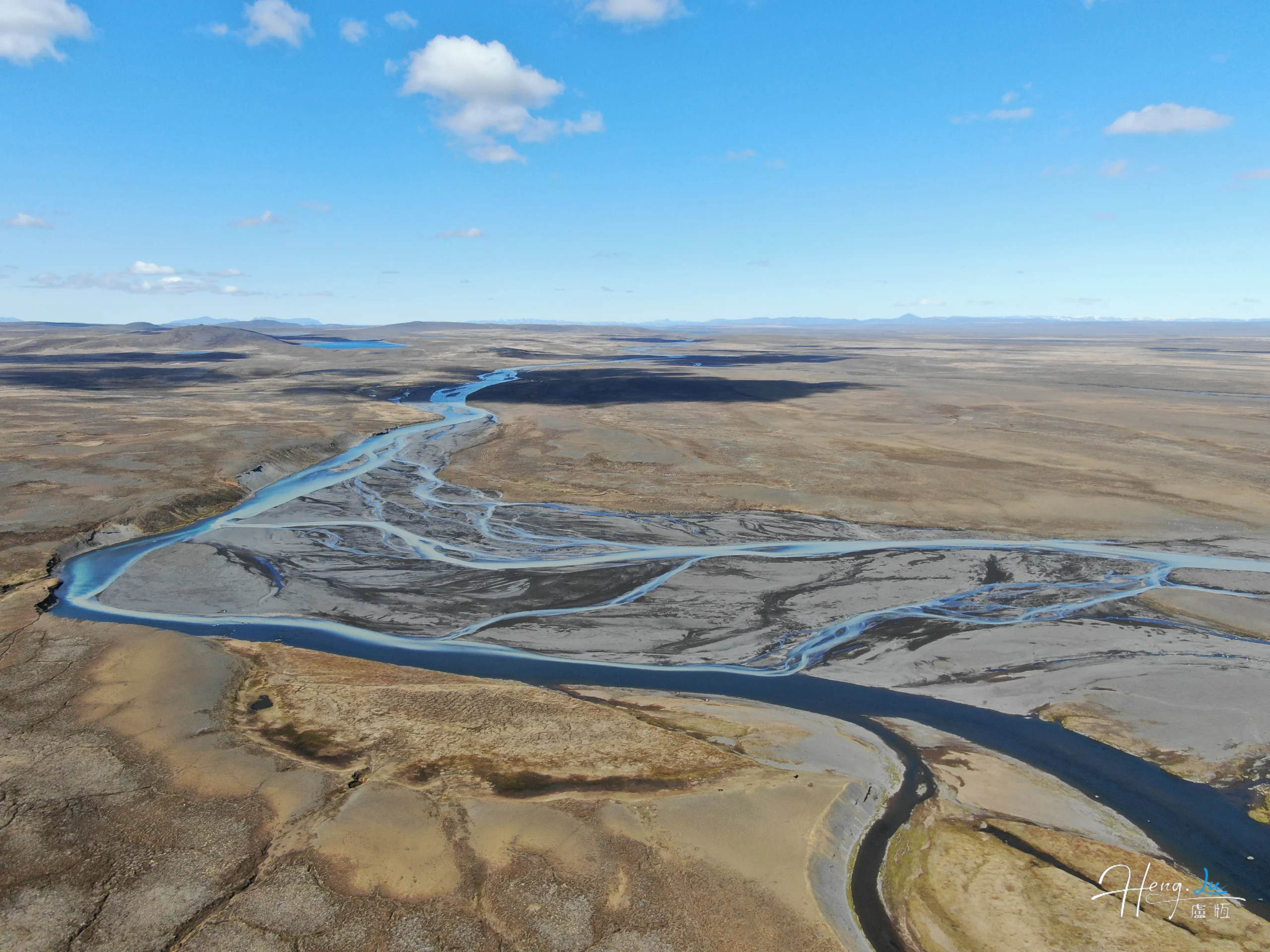 Aerial-view-of-river-delta-under-clear-blue-sky