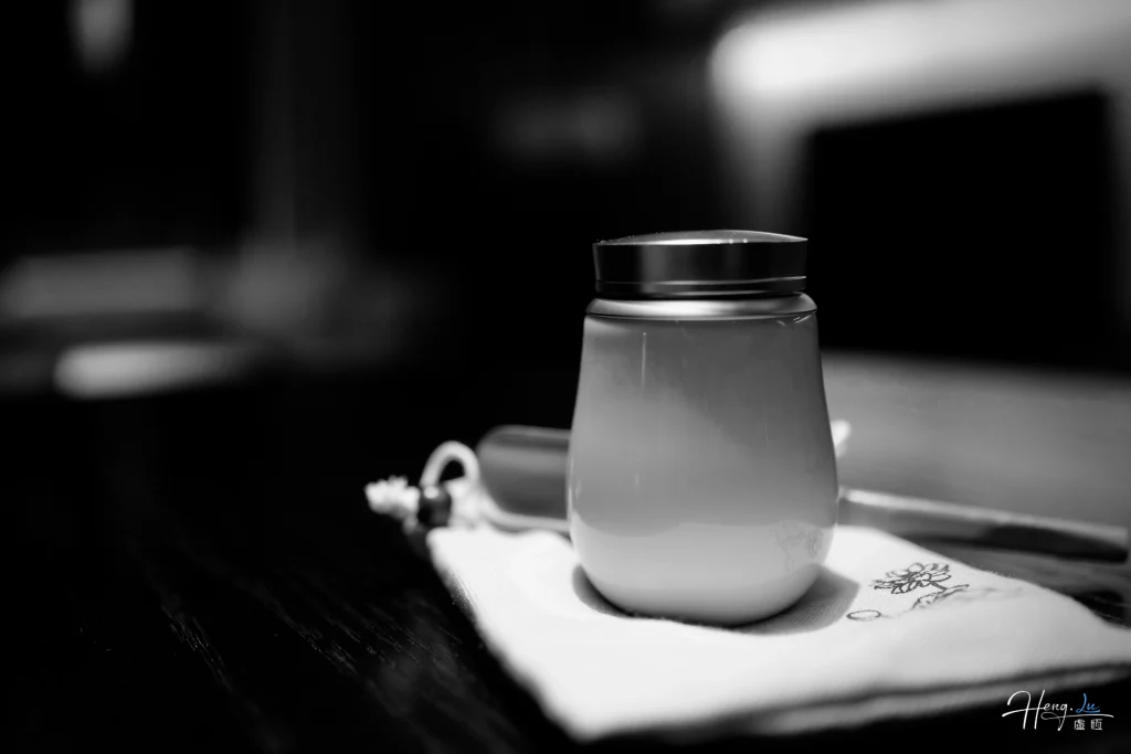 black-and-white-close-up-of-ceramic-cup-on-table