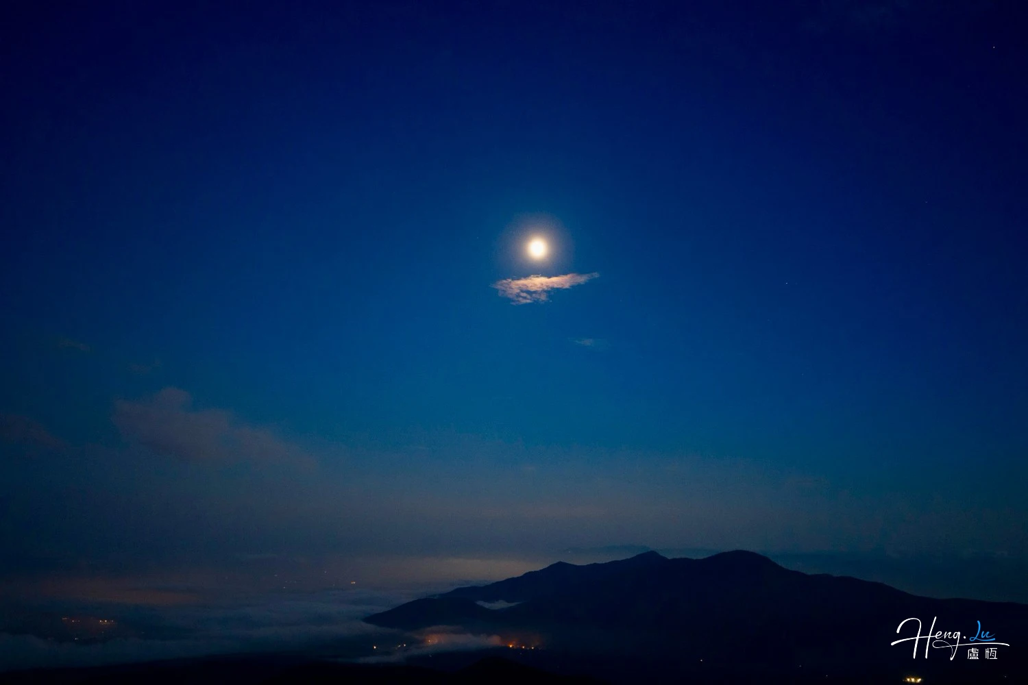 bright-moon-above-mountains-and-night-haze