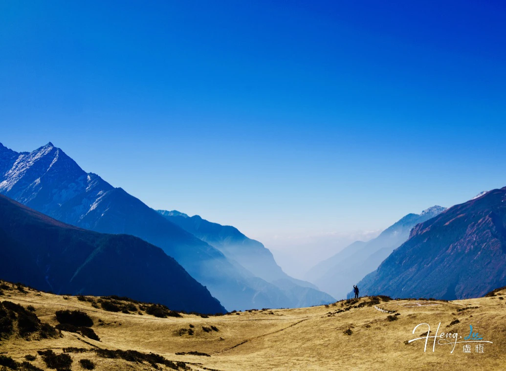 misty-mountain-valley-under-deep-blue-sky