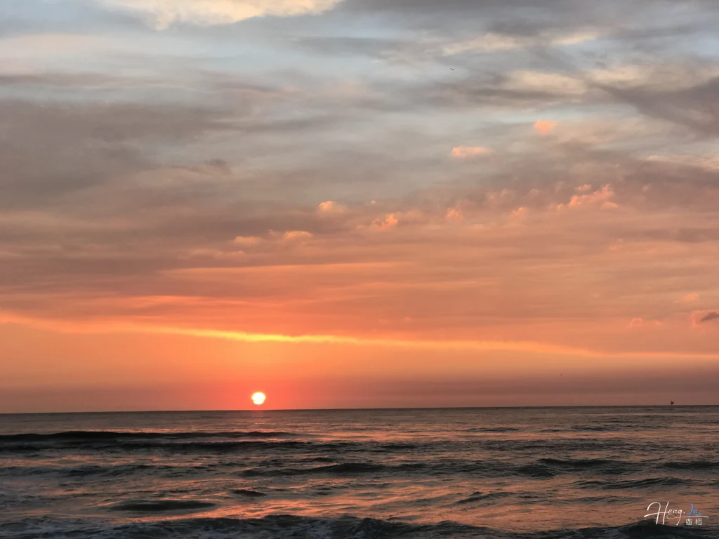 orange-sunset-over-peaceful-ocean-waves