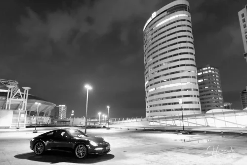 A-black-Porsche-in-an-empty-parking-lot