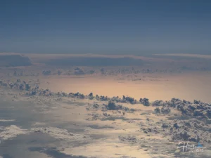 aerial-view-of-clouds-above-sunlit-ocean